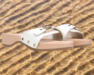 Dr. Scholl's shoes on sandy background