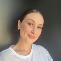 Erika Reals a contributing writer for Byrdie poses for a headshot.