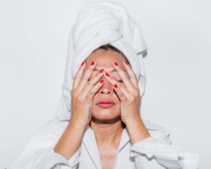 Woman touching face