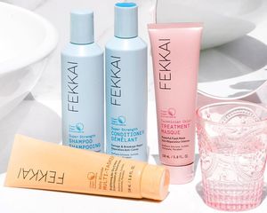 Fekkai shampoo, conditioner, treatment masque and dry cream on a bathroom sink.