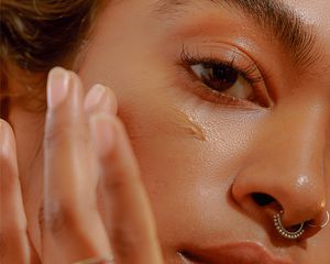 Woman applying foundation