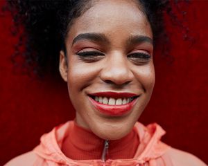 young woman smiling with monochromatic eyeshadow