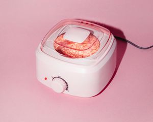 wax warmer on pink background