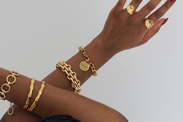 woman wearing gold jewelry