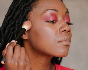 woman applying makeup