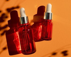 Bottles with plant shadows