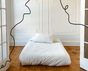 white bed on the floor