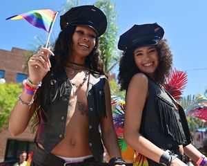 Two women wearing leather outfits at the 2022 West Hollywood Pride parade.