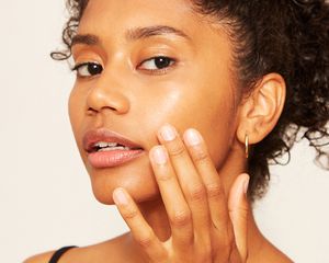woman touching face