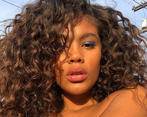 woman with long curly hair