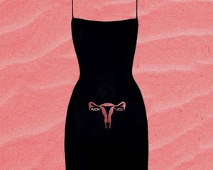 Black mini dress with glitter ovaries and Swarovski "fuck you."