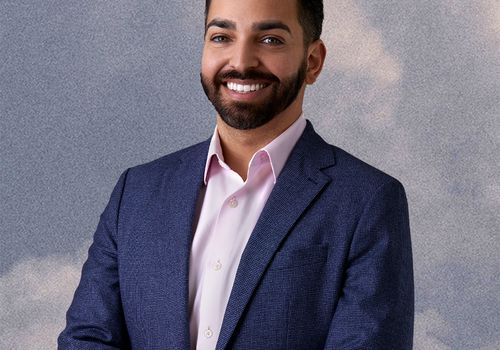 dr. shah poses for a headshot