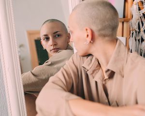 Person staring in mirror
