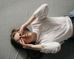 Woman rubbing eyes