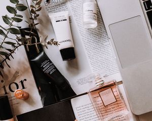 beauty products on a desk with computer