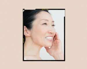 Mature woman touching her face