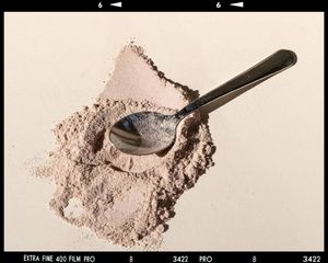 whey protein powder on a spoon