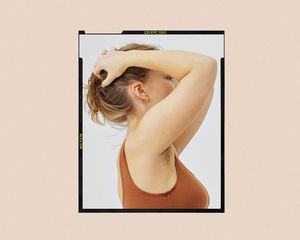Woman with her arms on her head