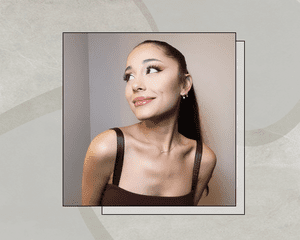 Ariana Grande Smiling Away from the Camera featuring Her Signature Ponytail, Winged Eyeliner, and Glossy Lips
