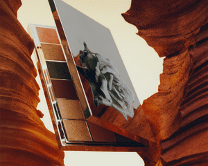 Byredo Flora Kalahari eyeshadow palette shot in a canyon