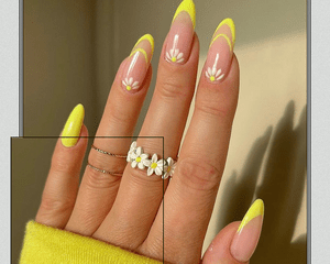 Yellow french manicure with daisy flower details