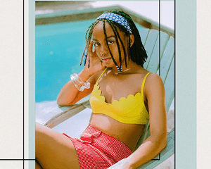 BIPOC Woman Sitting by a Pool in a Retro Inspired Bathing Suit