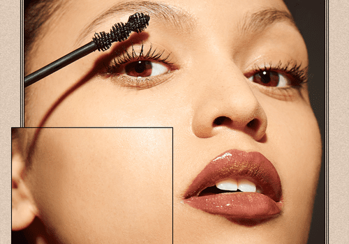 Woman applying mascara