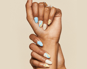 Daisy, cloud, and smiley face press on nail design