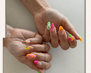 Mismatched check, flame, and smiley face nails