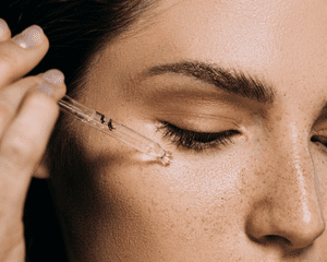 woman applying emulsion skincare